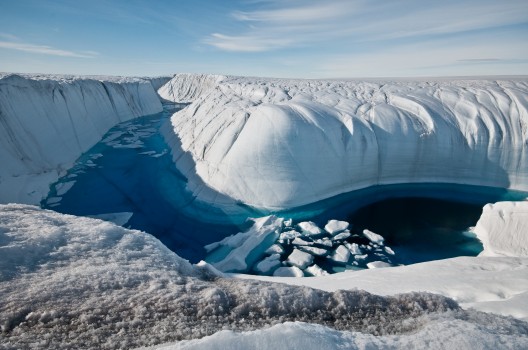 Greenland ice canyon filled with melt water in summer 2010 (photo: Ian Joughin, UW APL Polar Science Center)