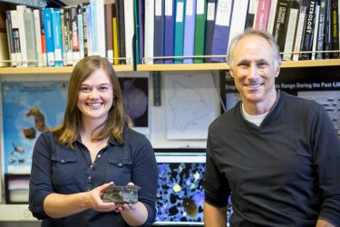 UW doctoral student Jillian Schleicher and UW professor of Earth and space sciences George Bergantz with a Mauna Loa basalt samples they will compare with the simulation results.
