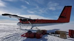 A Twin Otter plane on an Antarctic runway allows researchers like Holschuh to reach their study sites and collect radar data.
