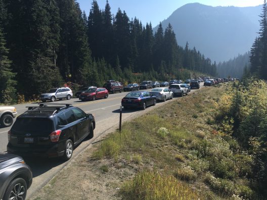 cars parked along a mountain highway