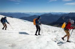 Brad Lipovsky (right) hikes over Easton Glacier on Washington’s Mount Baker in September 2021 with UW graduate students Danny Hogan (left) and Quinn Brencher.