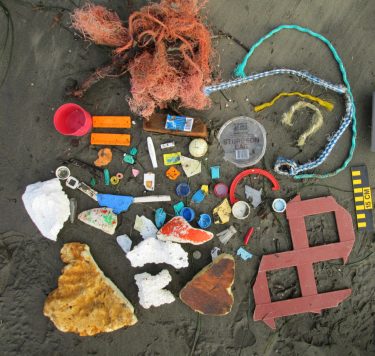 This litter collected at Devil’s Punchbowl on the Oregon coast in December 2012 shows a mix of bottle tops, fishing gear and plastic fragments. Analysis of larger items collected by volunteers from 2017 to 2021 shows that beaches have “sticky zones” where both organic material and litter tends to accumulate.