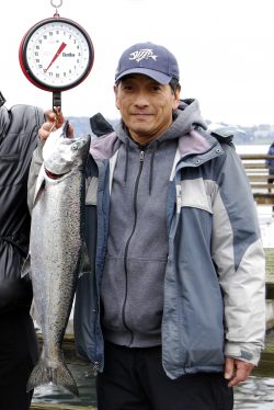 Doug Hanada holding a blackmouth salmon
