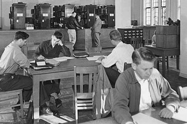 A historical photograph of students working on the UW campus
