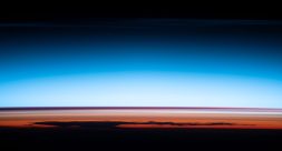 a photo showing layers of colors of the earth's atmosphere